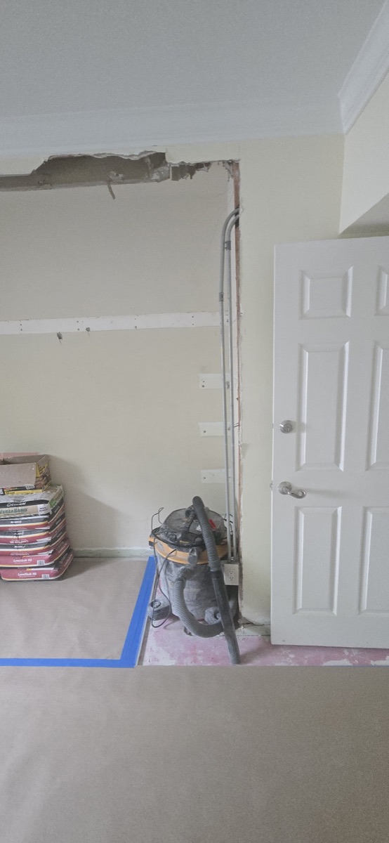 Before: wall opened, work area protected