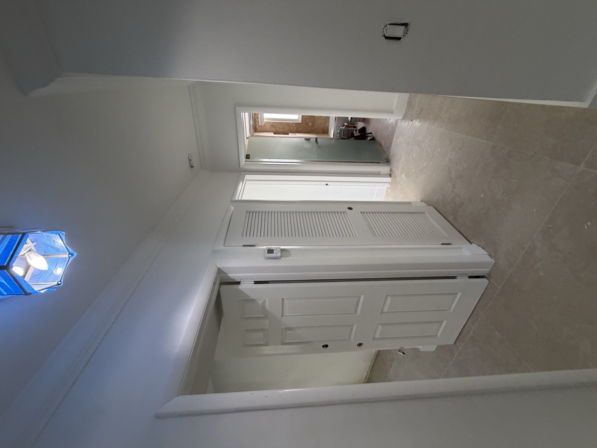 Hallway with new paint and tile floor